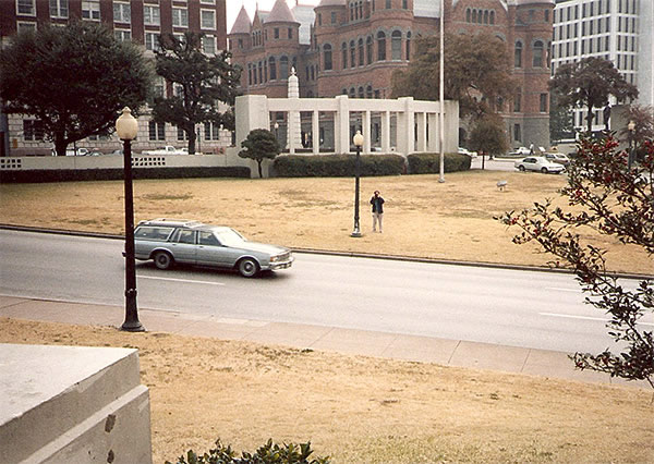 Looking over Elm Street from fence bordering grassy knoll