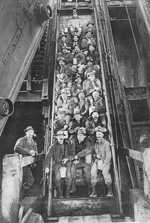 Miners descending on man car, Calumet, Michigan